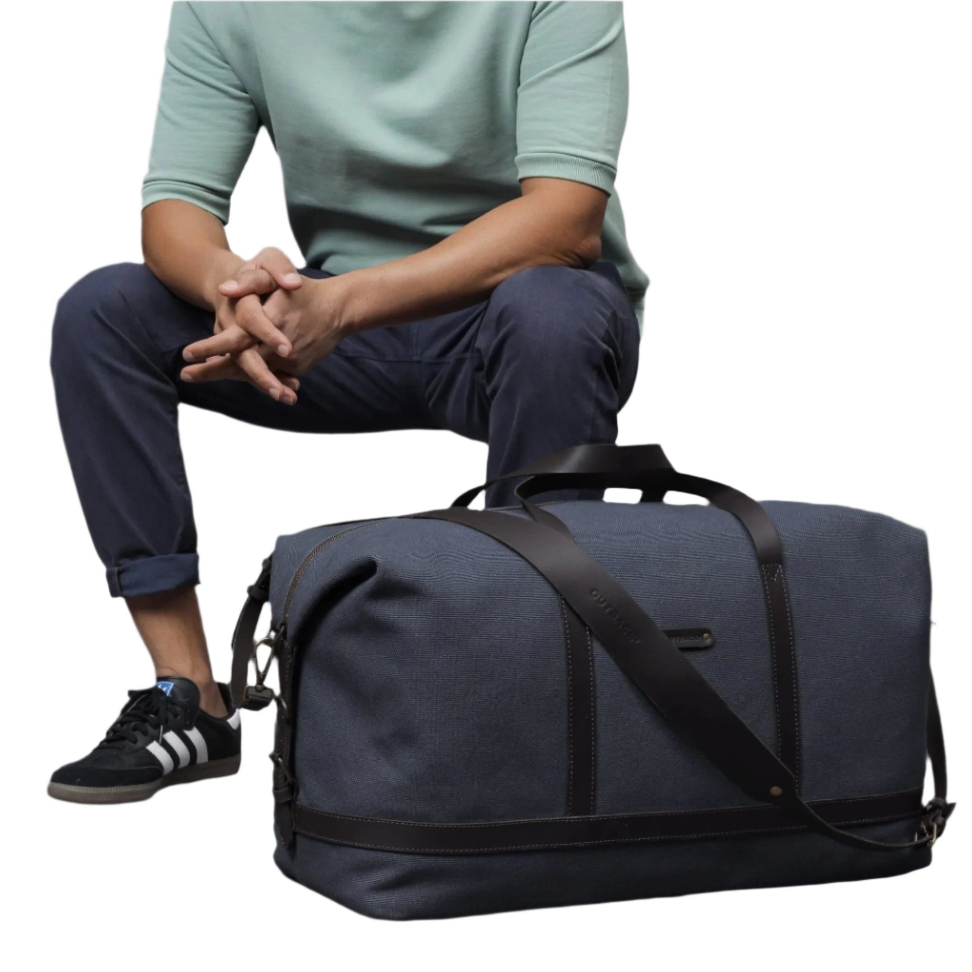 Gentleman sitting with stylish and spacious canvas duffel bag/weekender