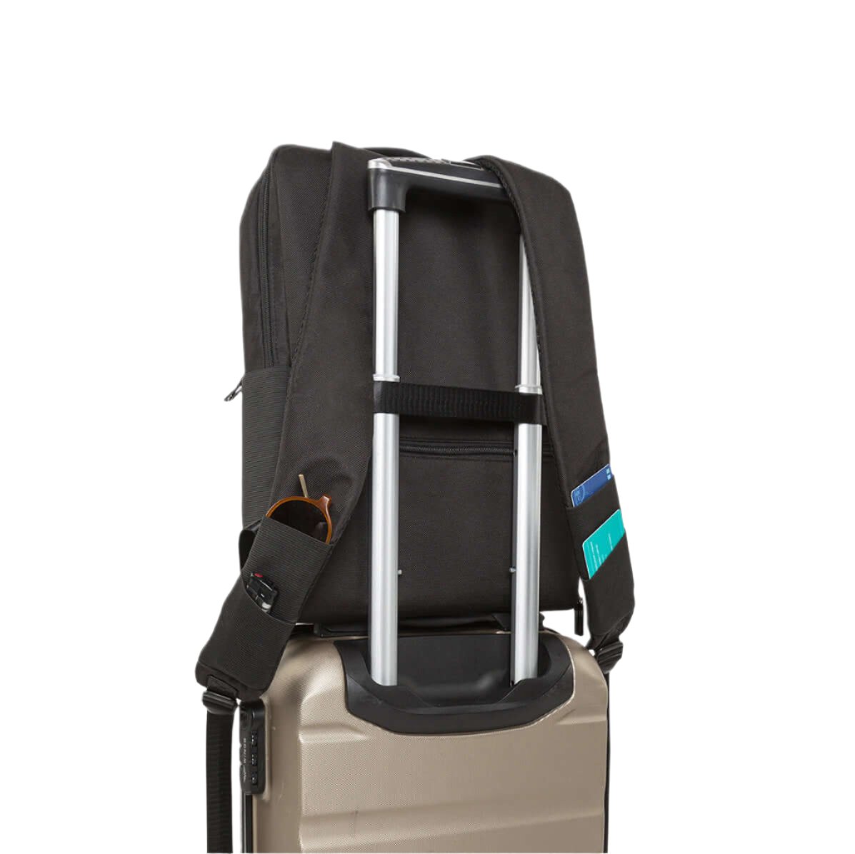 City-C daypack with luggage strap resting on suitcase 