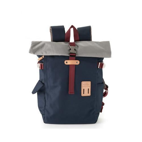 Navy blue rolltop style travel backpack from Harvest Label